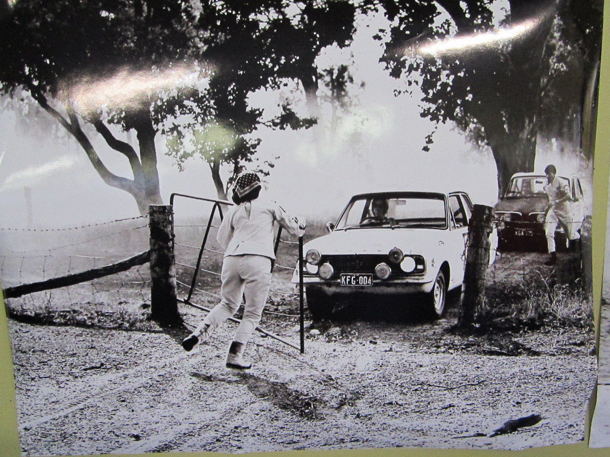 A lady navigator opening a gate on a BP section.