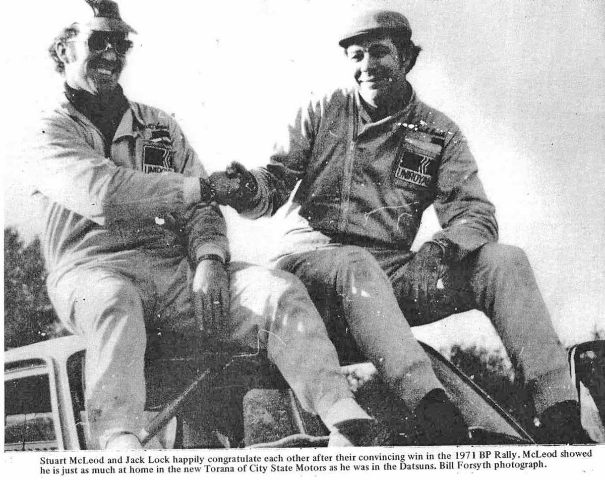 1971 BP Rally winners Stewart McLeod and Jack Lock sitting on the roof of their car.