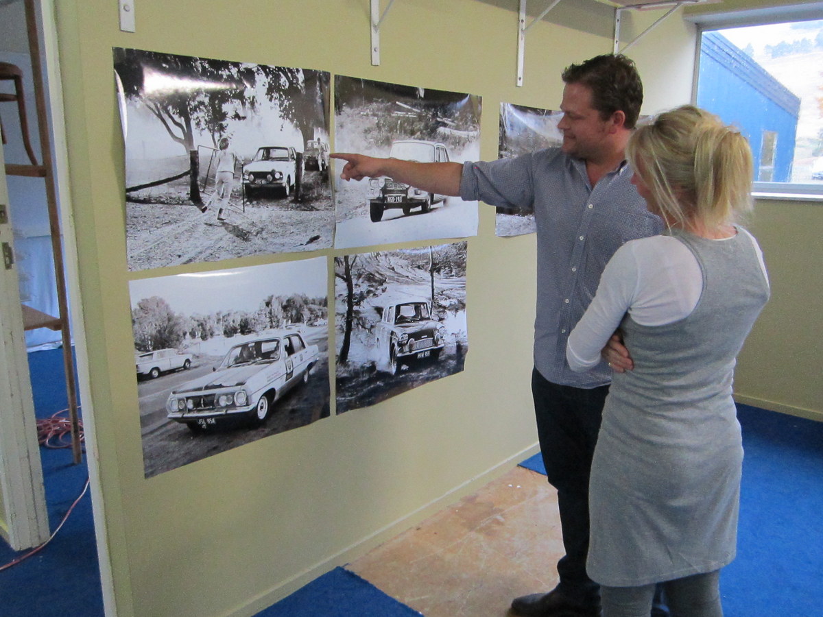 Two people looking at pics from Old BP Rallies