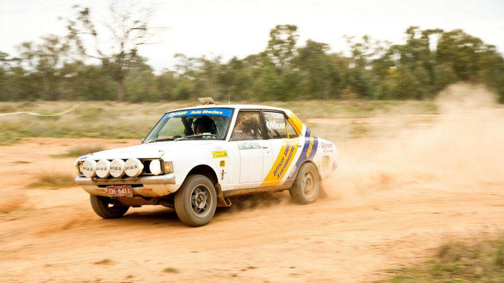 David and Kate Officer driving a Gallant on an autocross track.