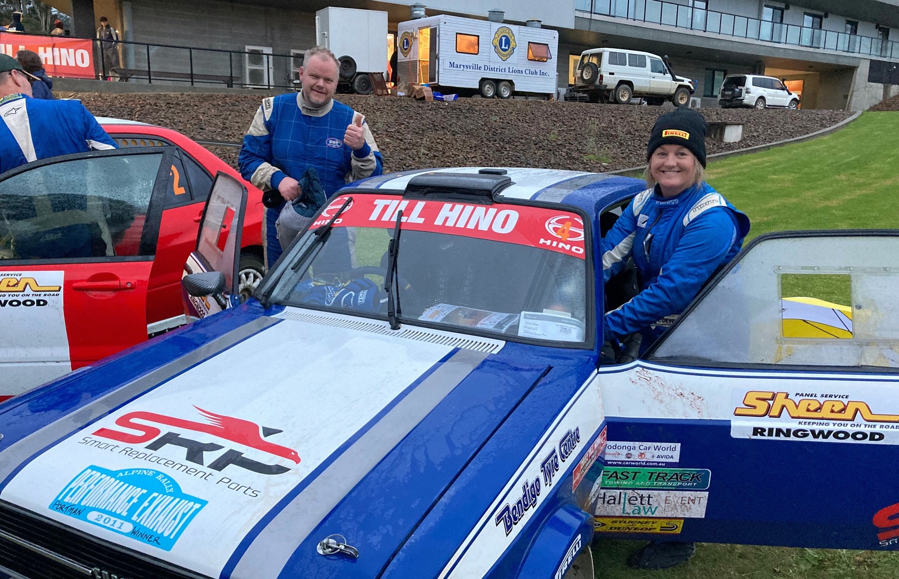 Luke Sytema and Tracey Dewhurst standing next to their car